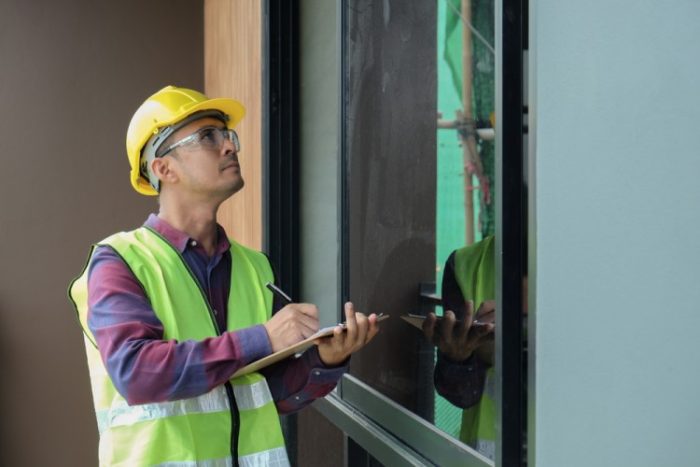 Why Should I Hire a Qualified Building Inspector? 3 Professional building inspector makes notes dureing building inspection
