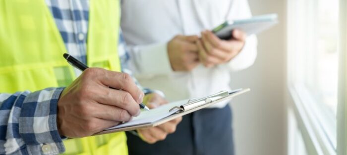 Why Skipping a Building Inspection Could Cost You Big 6 Building inspection officer making final report